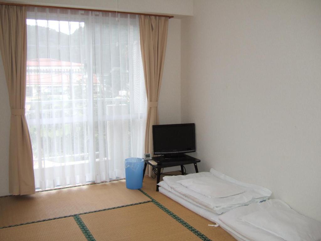 Pension Takatsuki Дзамамі Номер фото