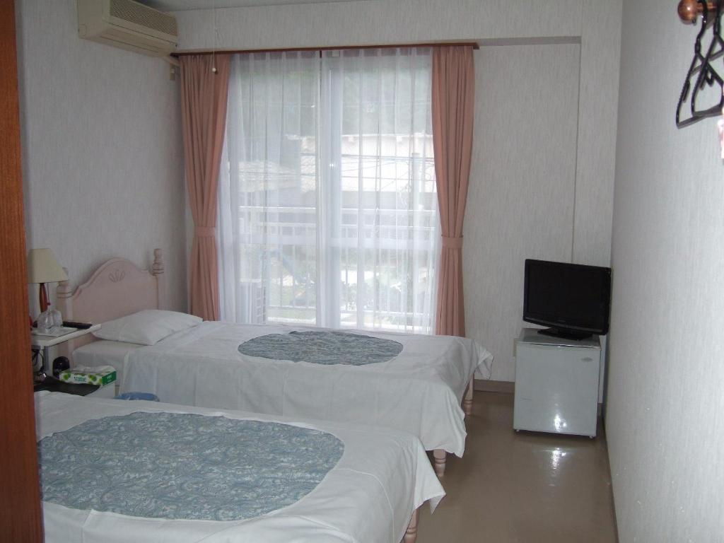 Pension Takatsuki Дзамамі Номер фото